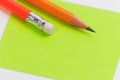 Closeup pink and green paper note with wood pencil. Royalty Free Stock Photo