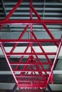 Closeup of pink horizontal bars for a workout, cylindrical crimson metal bars on a light silvery background.