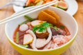 Closeup pink seafood flat noodles Yen ta fo