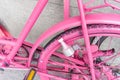 Closeup pink spay painted old bicycle