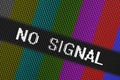 Closeup pixels of LCD TV screen with color bars and message no signal is a television test pattern Royalty Free Stock Photo