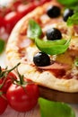 Closeup of pizza with ham and olives Royalty Free Stock Photo