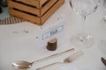 Closeup of a place setting with name tag on table at wedding banquet. Royalty Free Stock Photo