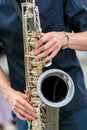 A closeup plane of saxophone player in black shirt