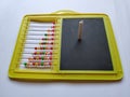 Plastic Colorful Beeds for Abacus , Black Board Slate with Chalk Piece on white background