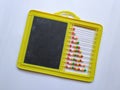 Plastic Colorful Beeds for Abacus , Black Board Slate with Chalk Piece on white background