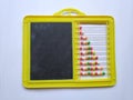 Plastic Colorful Beeds for Abacus , Black Board Slate with Chalk Piece on white background
