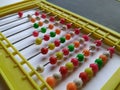 Plastic Colorful Beeds for Abacus , Black Board Slate with Chalk Piece on white background