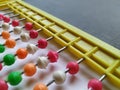 Plastic Colorful Beeds for Abacus , Black Board Slate with Chalk Piece on white background