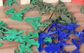 Closeup plastic green and blue soldiers on the table. Royalty Free Stock Photo