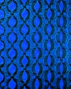 Bubble wrap in front of blue paper.