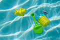 plastic toys floating in swimming pool Royalty Free Stock Photo