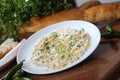 Closeup of a plate of chicken cilantro salad on a restaurant table