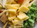 Closeup of a plate with a fast and easy snack. Cubes of cheese.