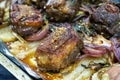 Closeup of a plate of grilled lamb chops with onions and potatoes Royalty Free Stock Photo