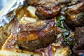 Closeup of a plate of grilled lamb chops with onions and potatoes Royalty Free Stock Photo