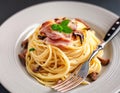 Closeup plate of spaghetti ham with Cabonara cream source with fork on table background Royalty Free Stock Photo