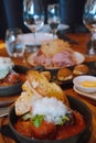 Closeup of plates filled with a variety of delicious food items on table