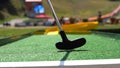 Closeup of player play mini golf with ball Royalty Free Stock Photo