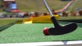 Closeup of player play mini golf Royalty Free Stock Photo