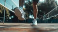 A closeup of a players footwork as they quickly move across the court to make a volley Royalty Free Stock Photo