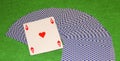 Closeup of playing cards with ace of hearts on green background, game Royalty Free Stock Photo