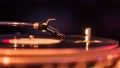 Closeup of a playing a vinyl record on a turntable at a electronic music event