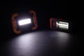 Closeup pocket LED flashlight on dark background Royalty Free Stock Photo