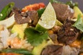 Closeup poke with beef and rice and vegetables. Hawaiian cuisine.