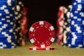 Closeup of poker chips on green felt card table surface Royalty Free Stock Photo