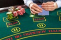 Closeup of poker player with playing cards and chips Royalty Free Stock Photo