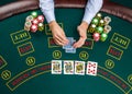 Closeup of poker player with playing cards and chips Royalty Free Stock Photo