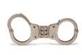 Closeup police handcuffs rigid joint white background Royalty Free Stock Photo