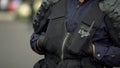 Closeup of policeman maintaining public safety during festival, traffic laws Royalty Free Stock Photo