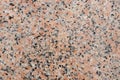 Closeup of a polished red granite texture with black and grey sp Royalty Free Stock Photo