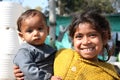 Closeup of poor girl with baby new delhi india