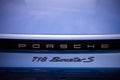 Closeup of Porsche 718 boxer S sign on the rear of blue car parked in the street