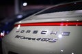 Closeup of the Porsche 911 Carrera 4 GTS car rear in artificial light. Royalty Free Stock Photo