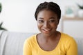 Closeup Portrait Of Attractive Young Black Woman Posing On Couch At Home Royalty Free Stock Photo
