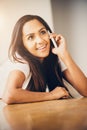 Closeup portrait of attractive young teenage girl talking mobile Royalty Free Stock Photo