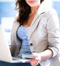 Closeup portrait of an attractive young woman with a laptop Royalty Free Stock Photo