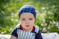 Closeup portrait of baby boy with big eyes. Serious little boy with intent look