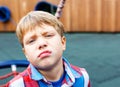 Closeup portrait of a baby boy making a funny face Royalty Free Stock Photo