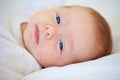 Closeup, portrait and baby for wake up in bedroom for sleep, relax or peaceful in morning. Infant, happy or good dream Royalty Free Stock Photo