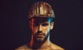 Closeup portrait of bearded architect or engineer in construction helmet. Handsome male builder, contractor, foreman in Royalty Free Stock Photo