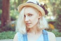 Closeup portrait of beautiful Caucasian teenage young blonde alternative model girl woman in blue tshirt Royalty Free Stock Photo