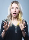 Closeup portrait of a girl, on an isolated gray background. Human face expression, emotions, feeling attitude reaction