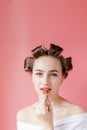 Closeup portrait of beautiful girl putting on red lipstick Royalty Free Stock Photo