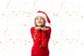 Closeup portrait of beautiful girl in red with santa hat holding Royalty Free Stock Photo