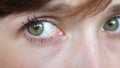Closeup portrait of beautiful gray-green eyes of a young beautiful woman. beautiful galaza girls closeup.